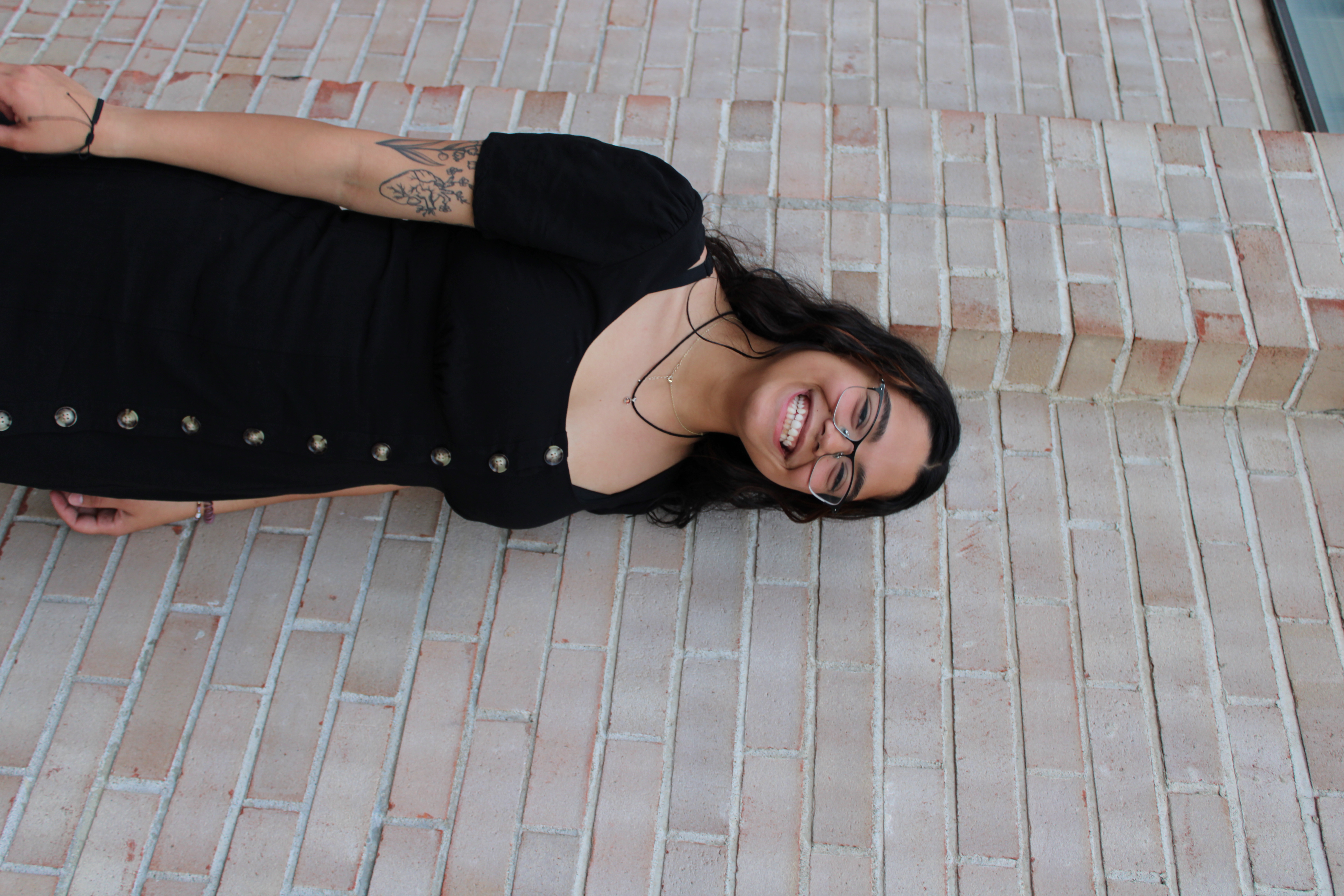 Alyssa, Tampa Bay photographer, smiling with camera